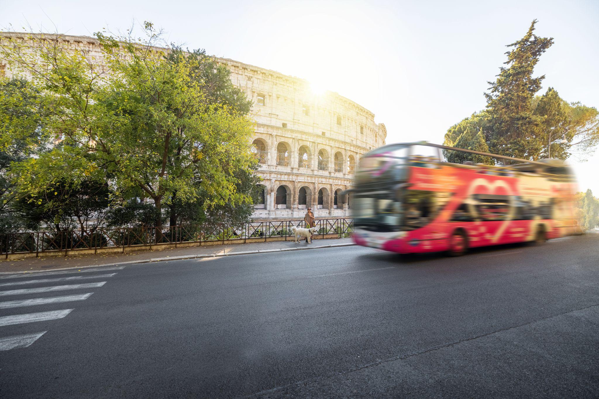 Street view with motion blurred tourist bus