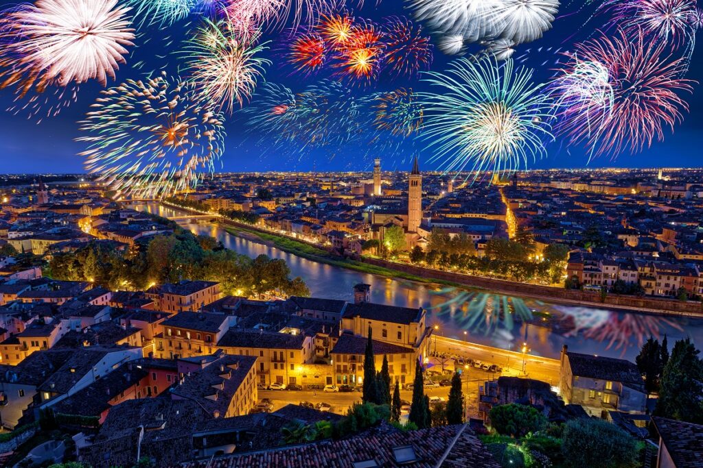 Colorful Fireworks above Verona Cityscape, in Italy