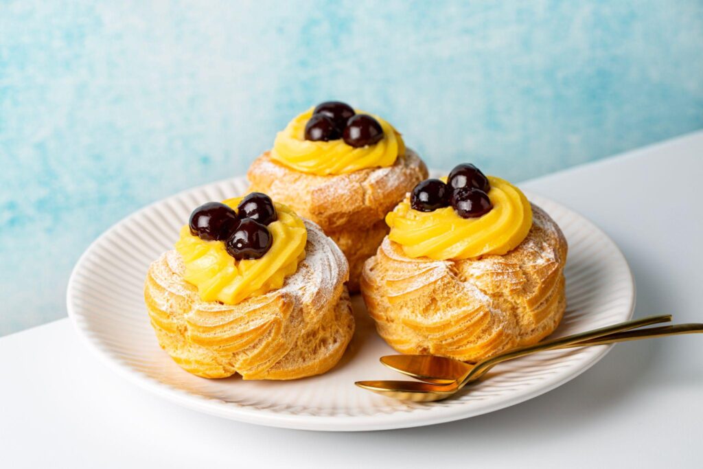 Italian pastry - zeppole di San Giuseppe, zeppola - baked puffs made from choux pastry