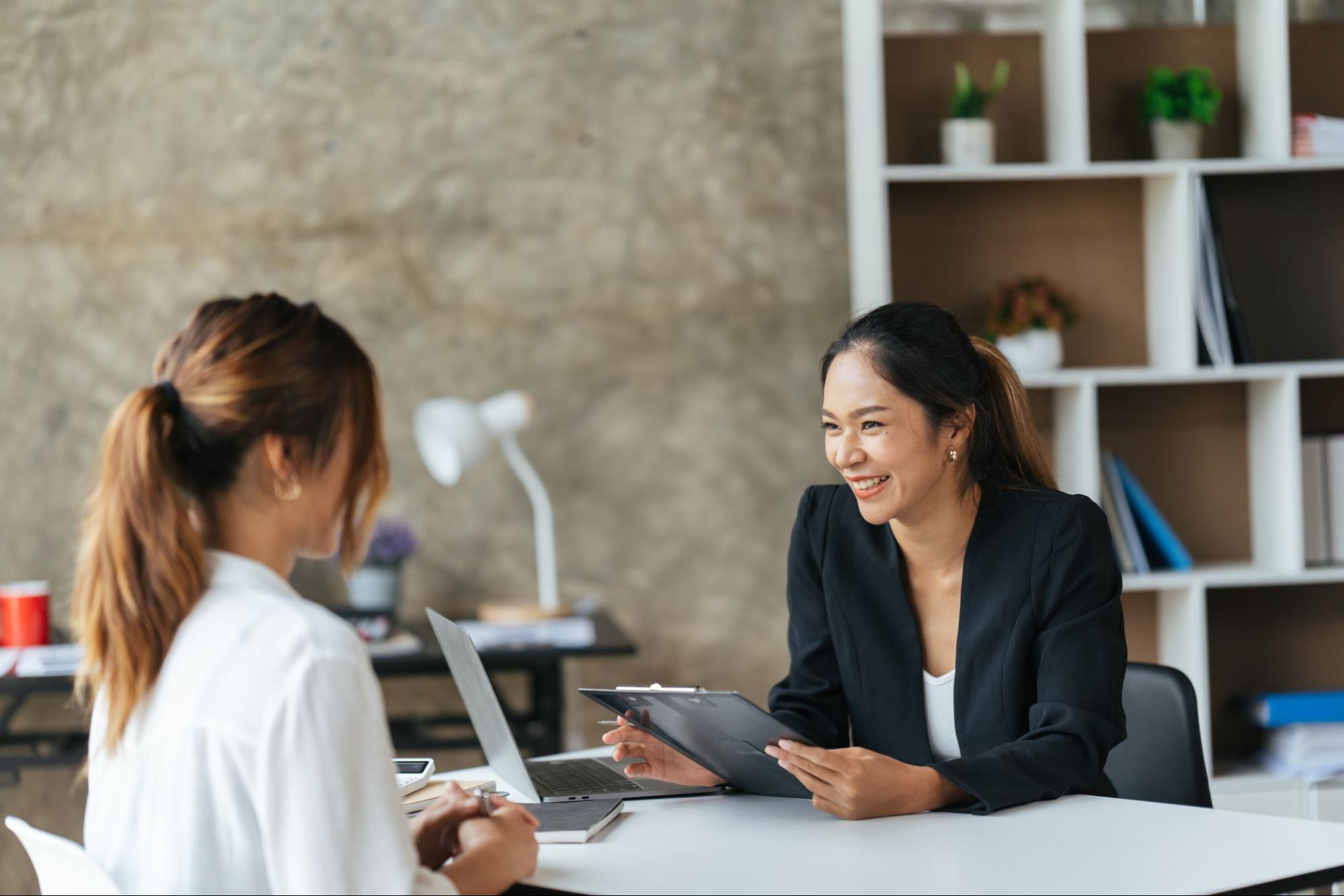 A woman talking to a banker