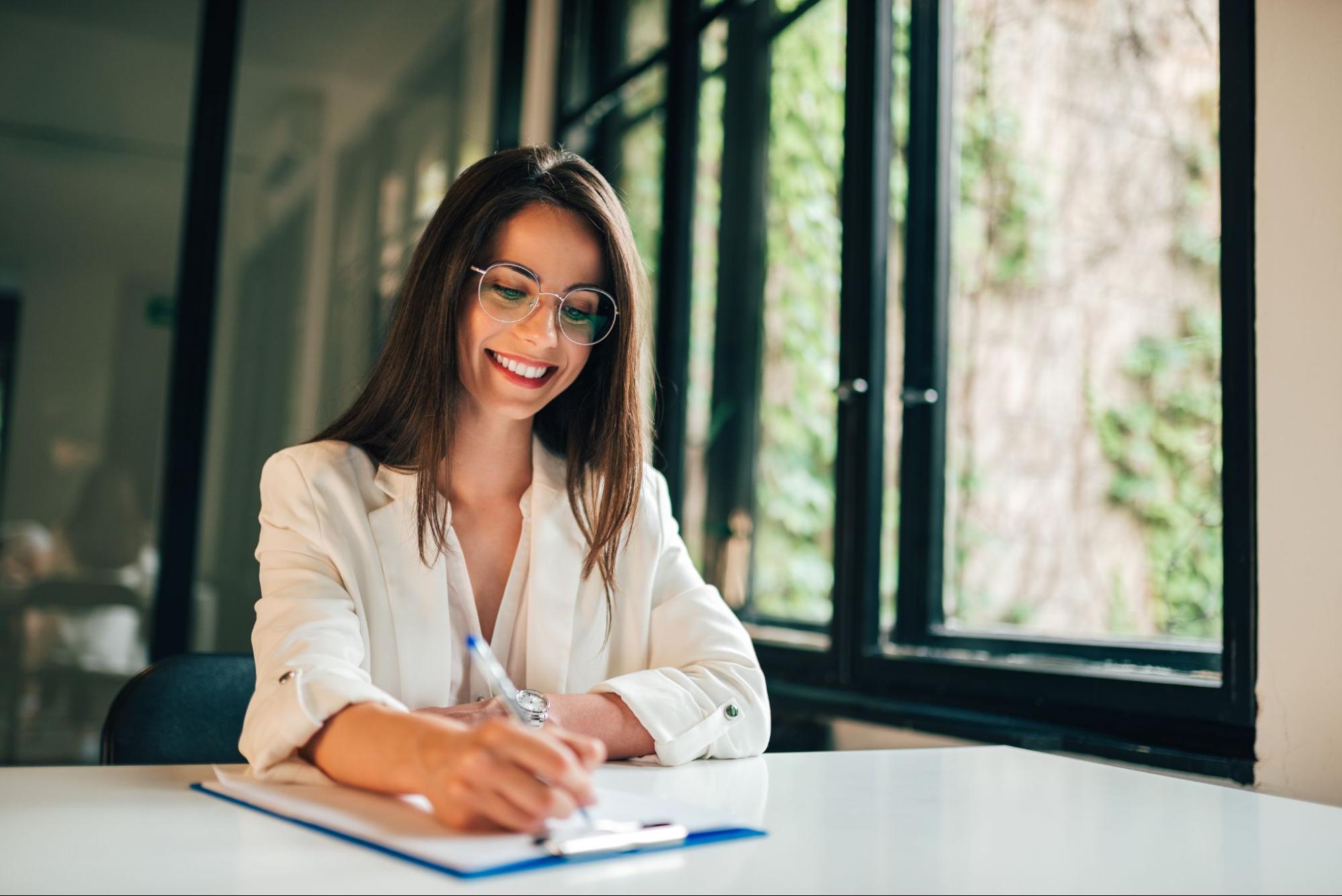 A woman filling out paperwork